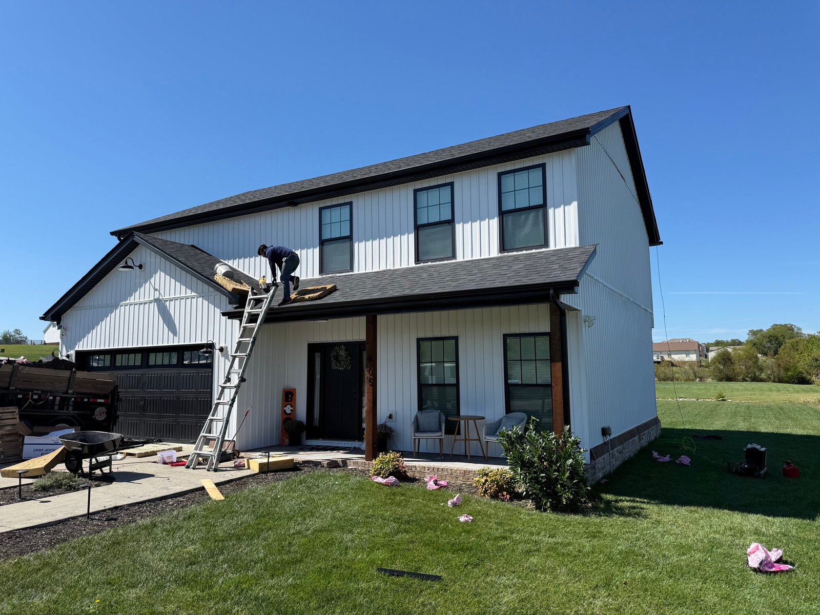 JL Home Improvements crew working on a modern home roof in Central Kentucky